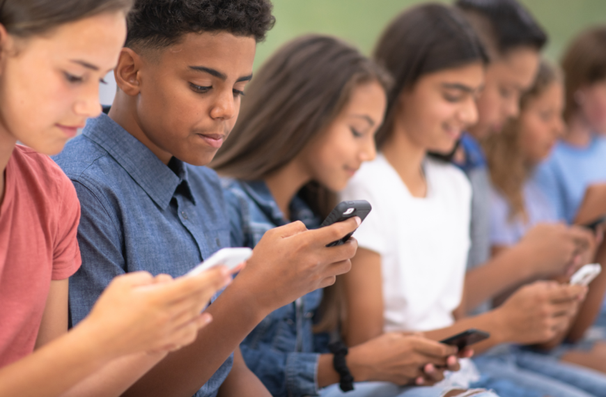 Students looking at cell phones