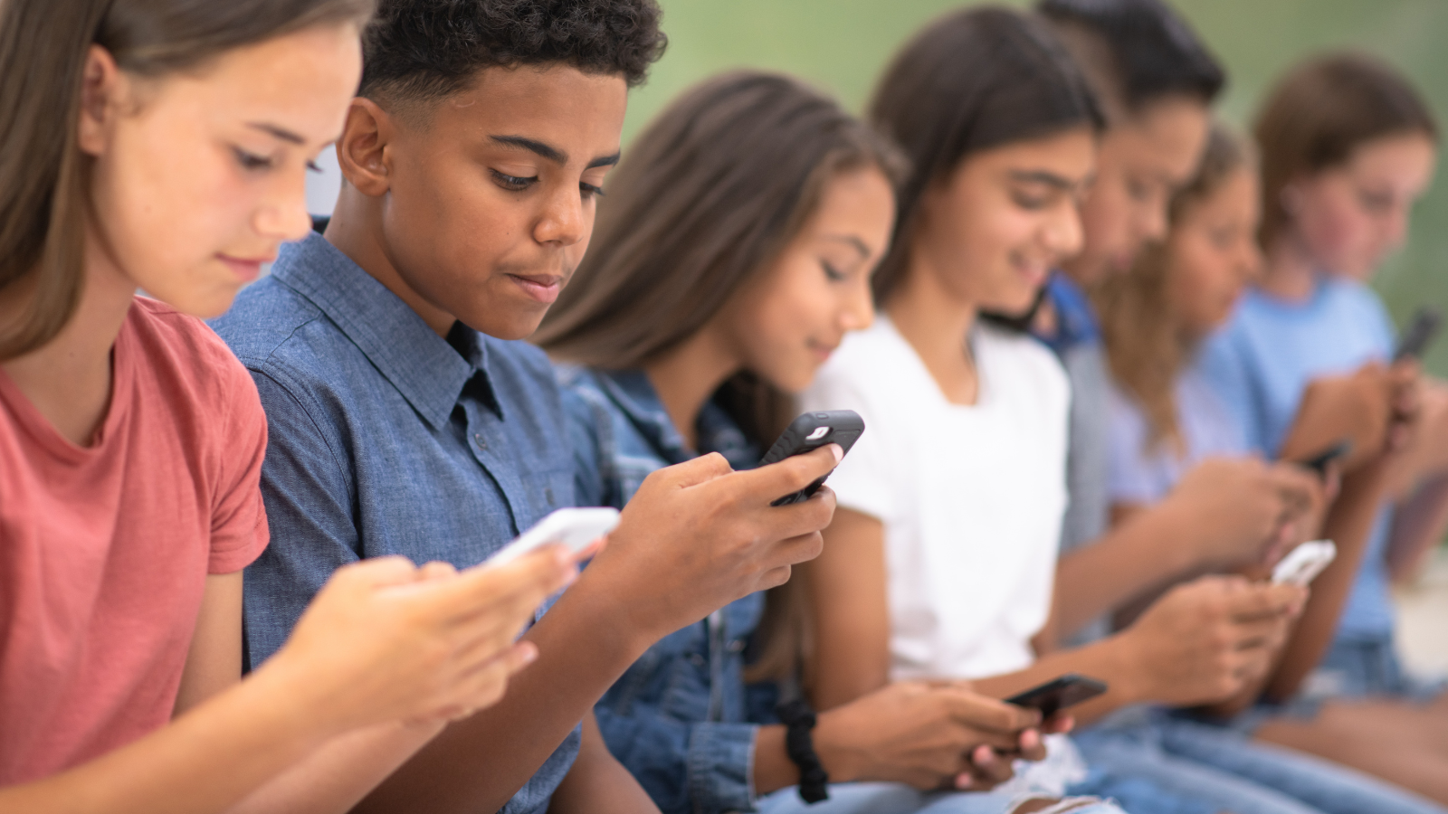 Students looking at cell phones